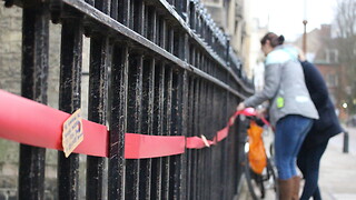 Students use red ribbons to campaign against climate change