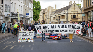 Climate activists halt traffic and occupy bank