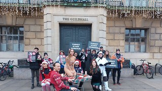 Animal rights groups stage 'Christmas dinner' protest in market square 