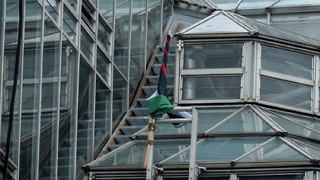 Night climbers place Palestinian flag on Seeley Library 