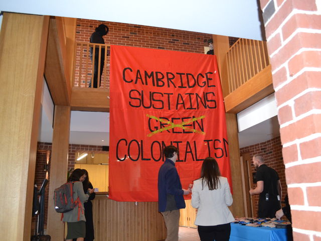 Environmental activists disrupt Cambridge climate conference
